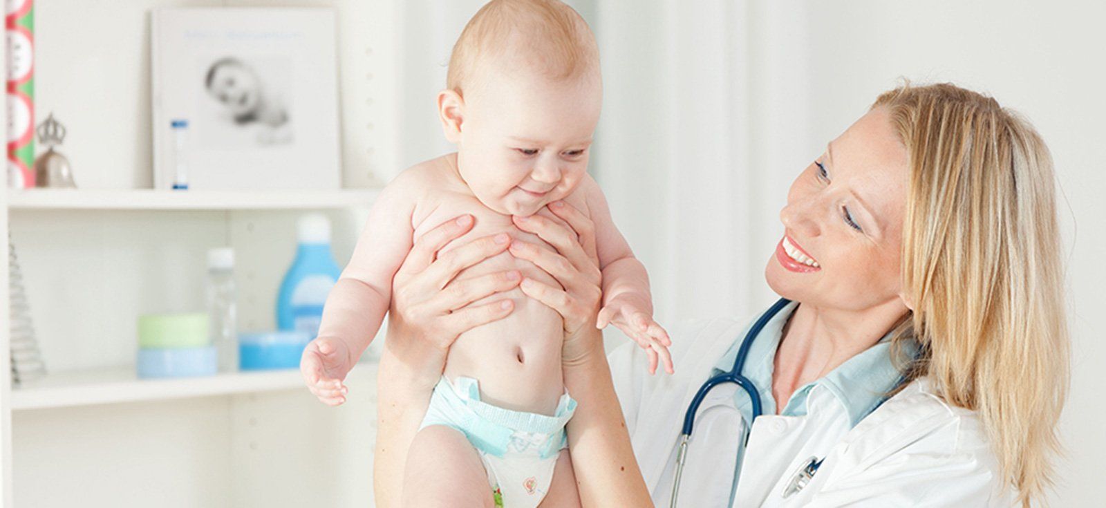 Happy baby and doctor