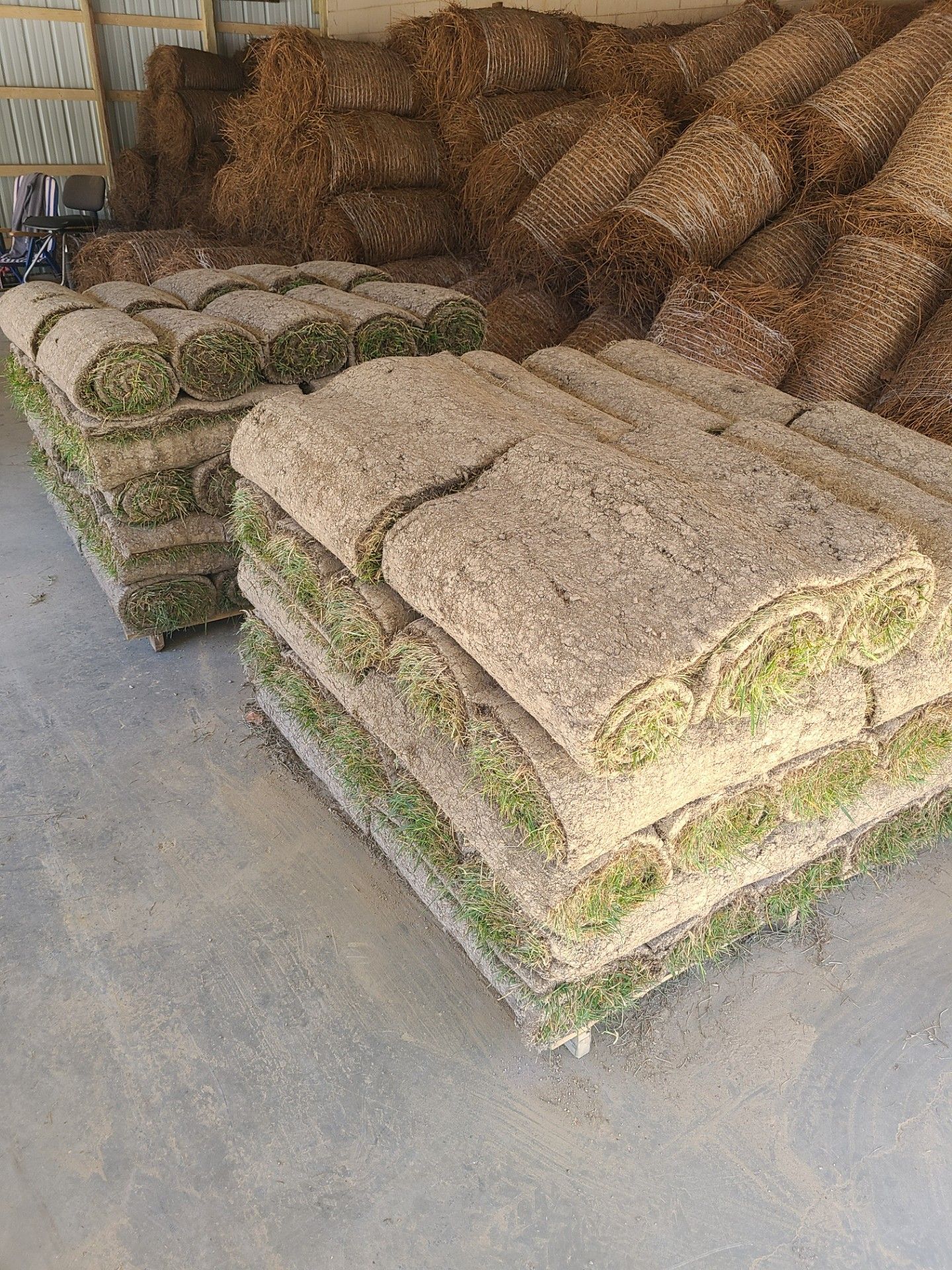 Stacks of sod rolls, ready for installation.