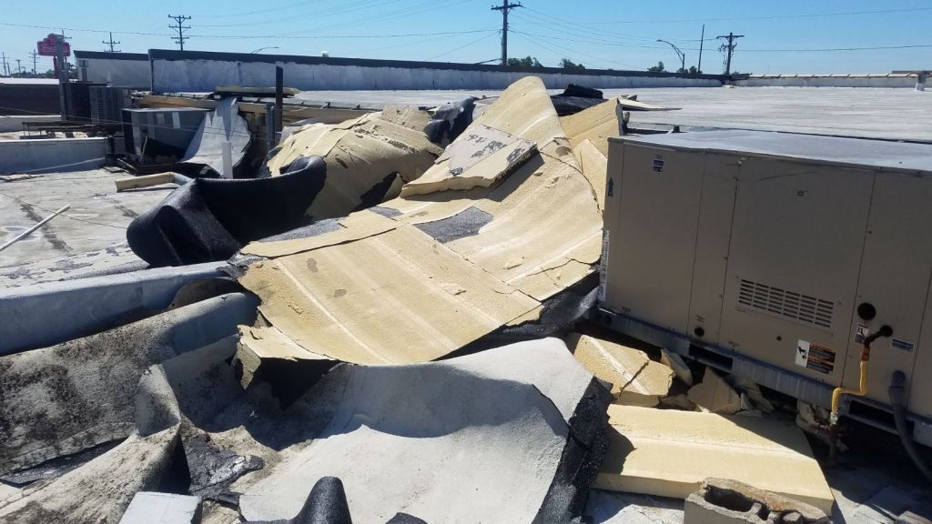 A roof with a lot of pieces of concrete on it