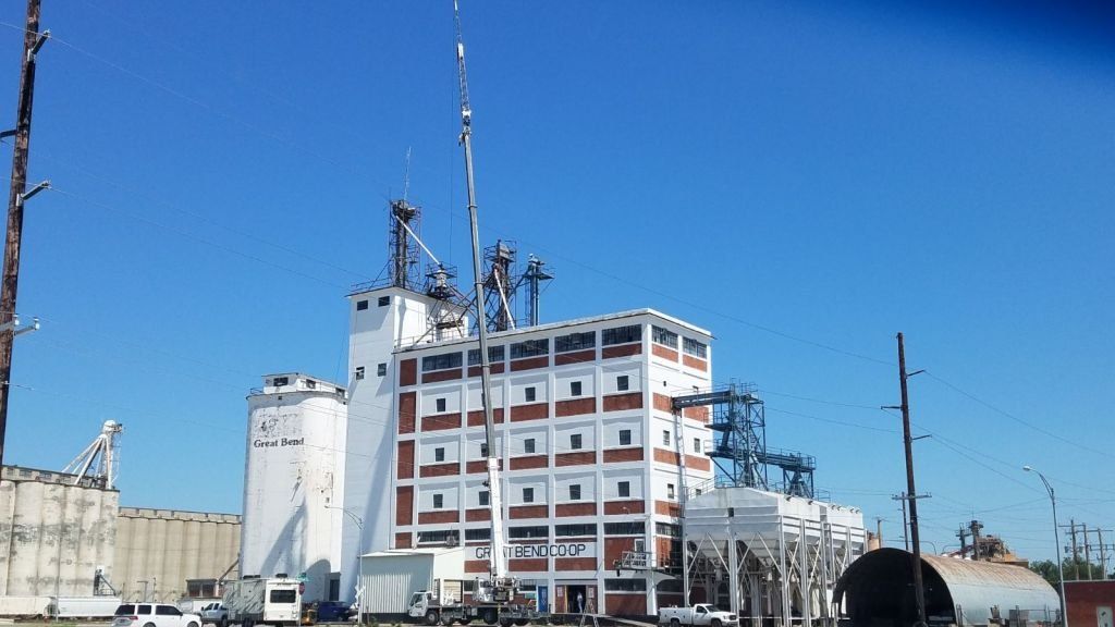 A large building with a blue sky in the background