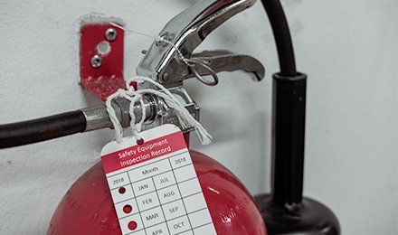 Learn more about parts and sales Holding fire extinguisher