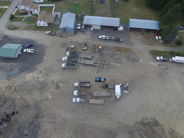 An aerial view of a lot of trucks and buildings