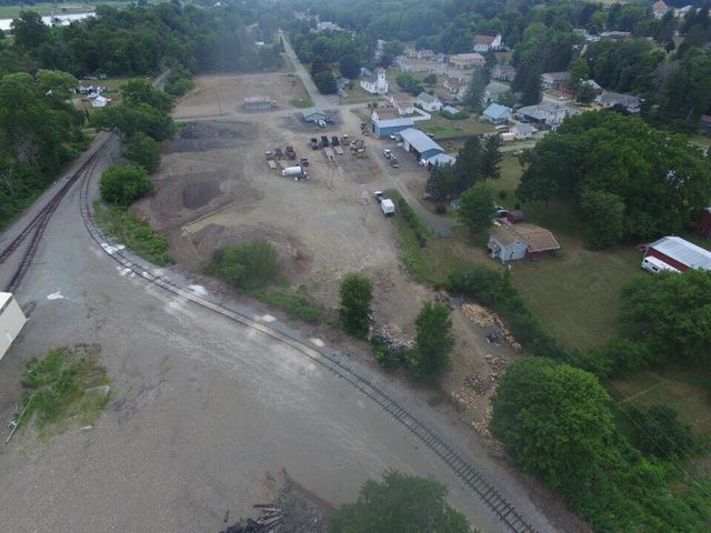 An aerial view of a train track in a small town