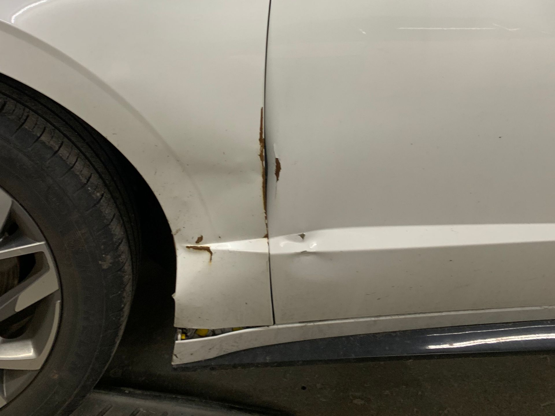 before - damaged white car