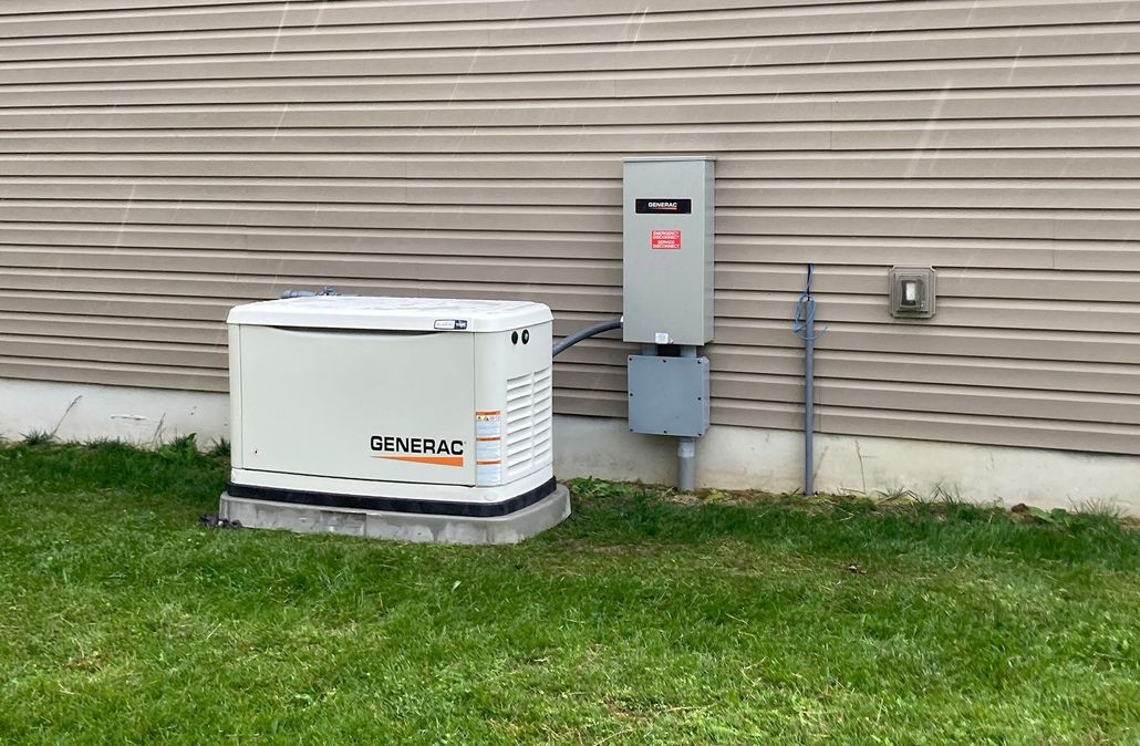 Outdoor GENERAC generator beside a house with utility box and gas meter on the grass