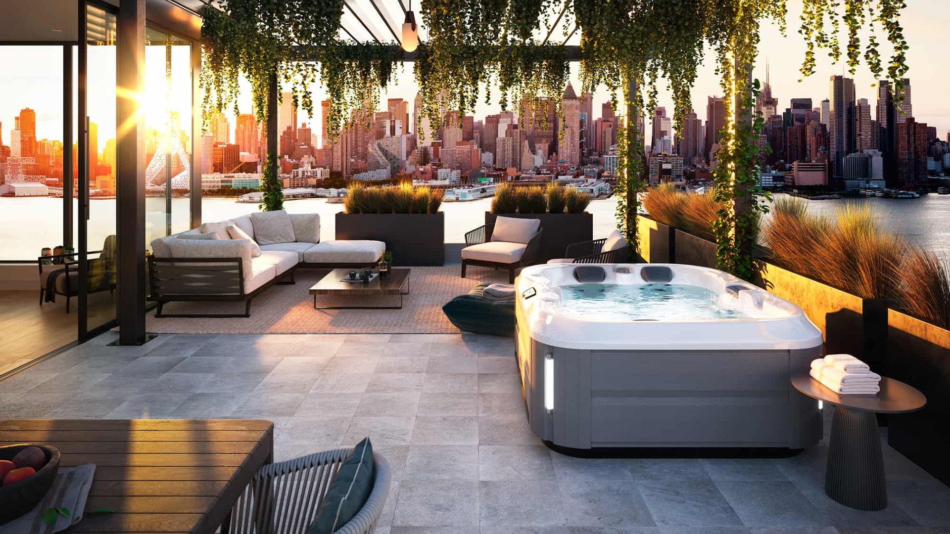 There is a hot tub on the roof of a building with a view of the city.