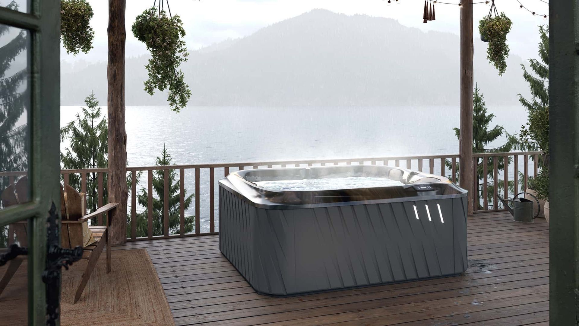 A hot tub on a deck overlooking a lake