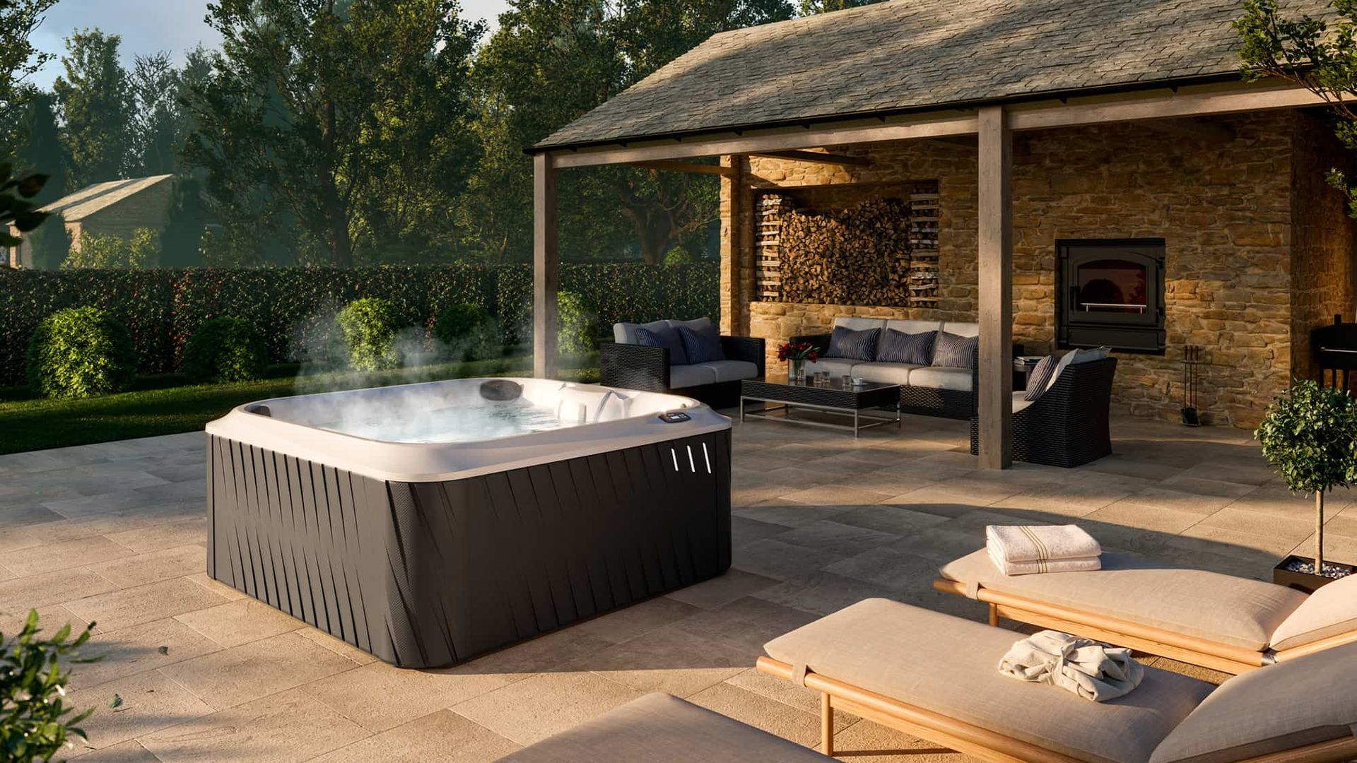 A hot tub is sitting on a patio next to a house.