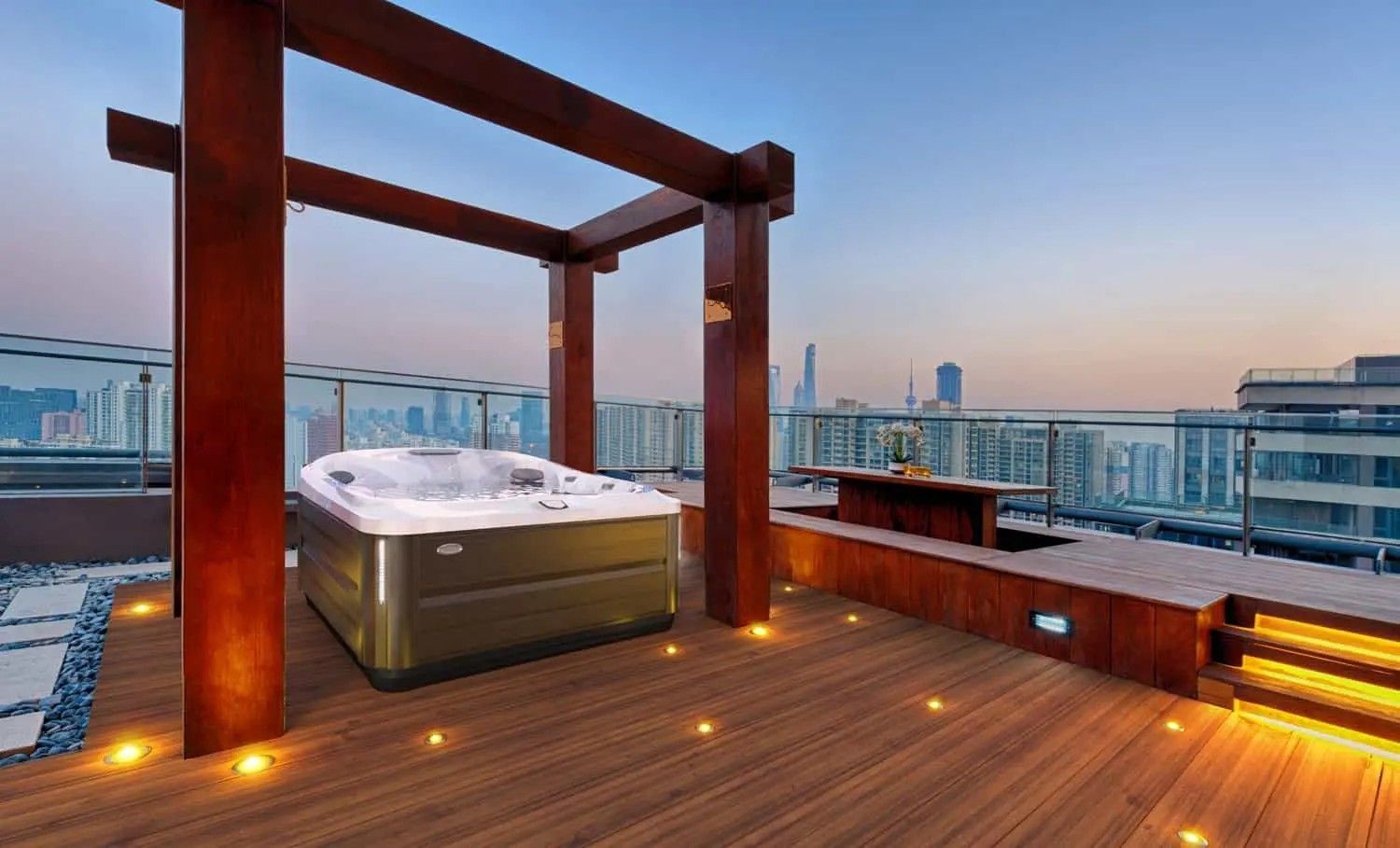 A hot tub is sitting on top of a wooden deck.