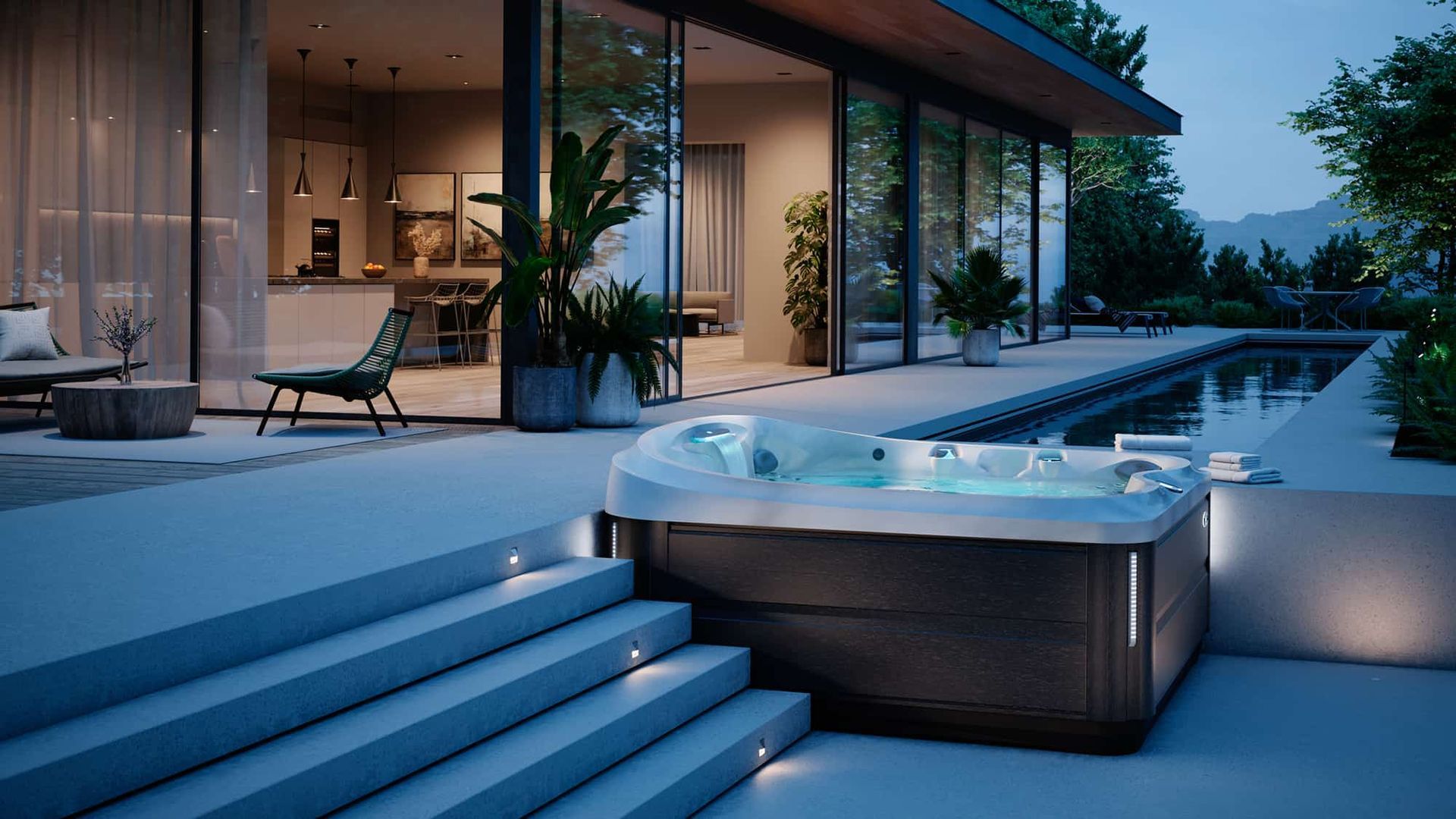A hot tub is sitting on the steps of a house next to a swimming pool.