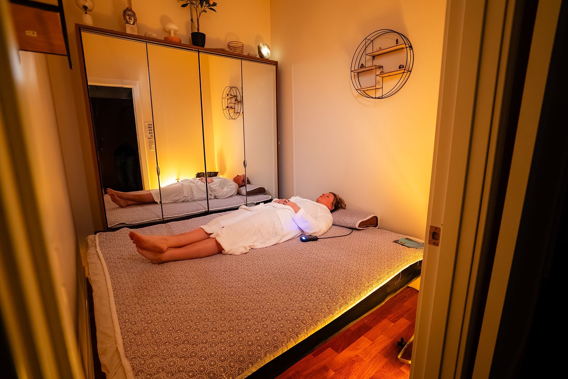 Woman lying on a bioacoustic mat