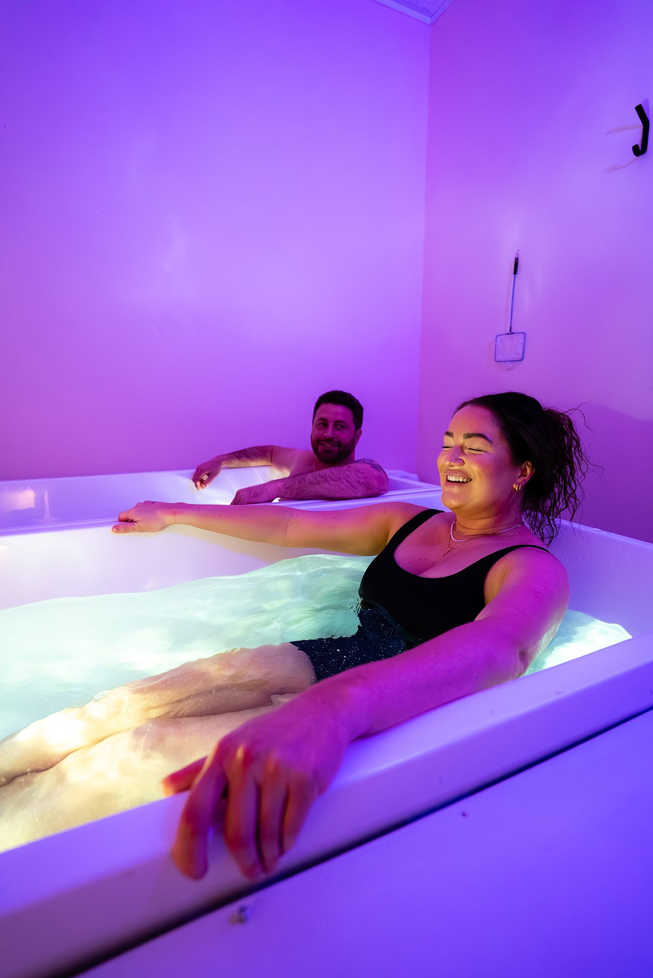 Woman smiling in while in a tub