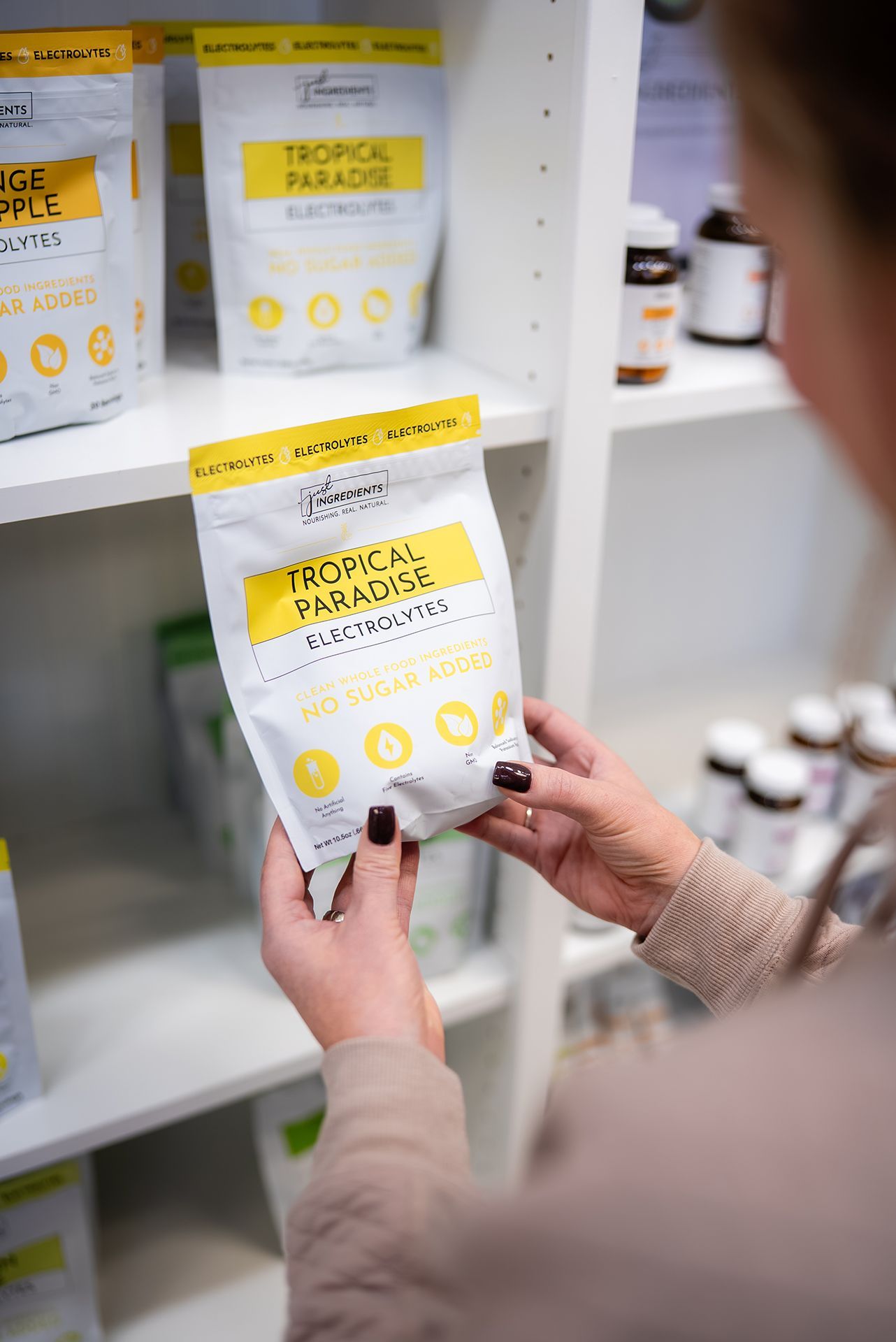 Woman examining a supplement package