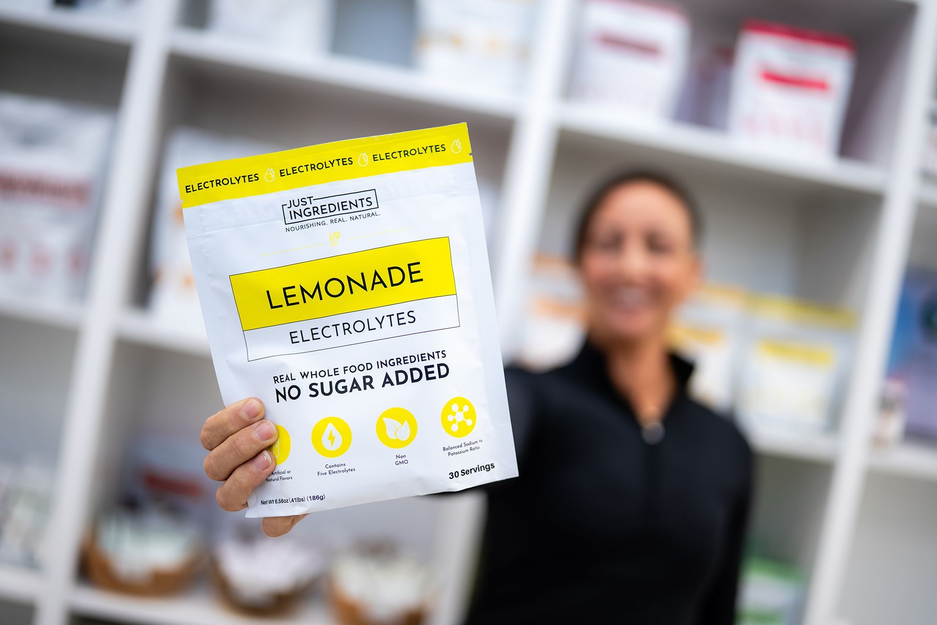 Woman holding a bag of Lemonade Electrolytes