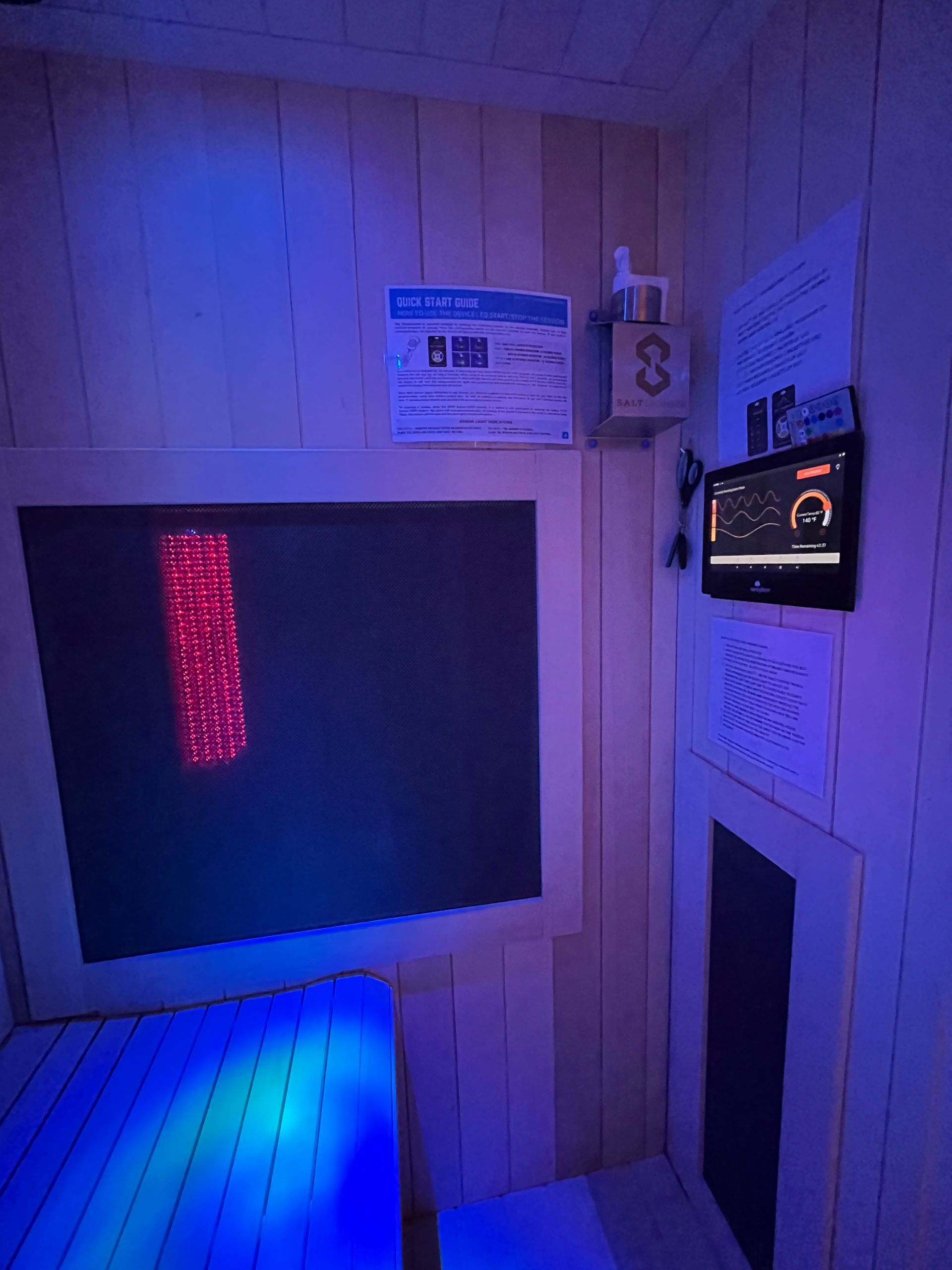 a room with a bed and a television on the wall .