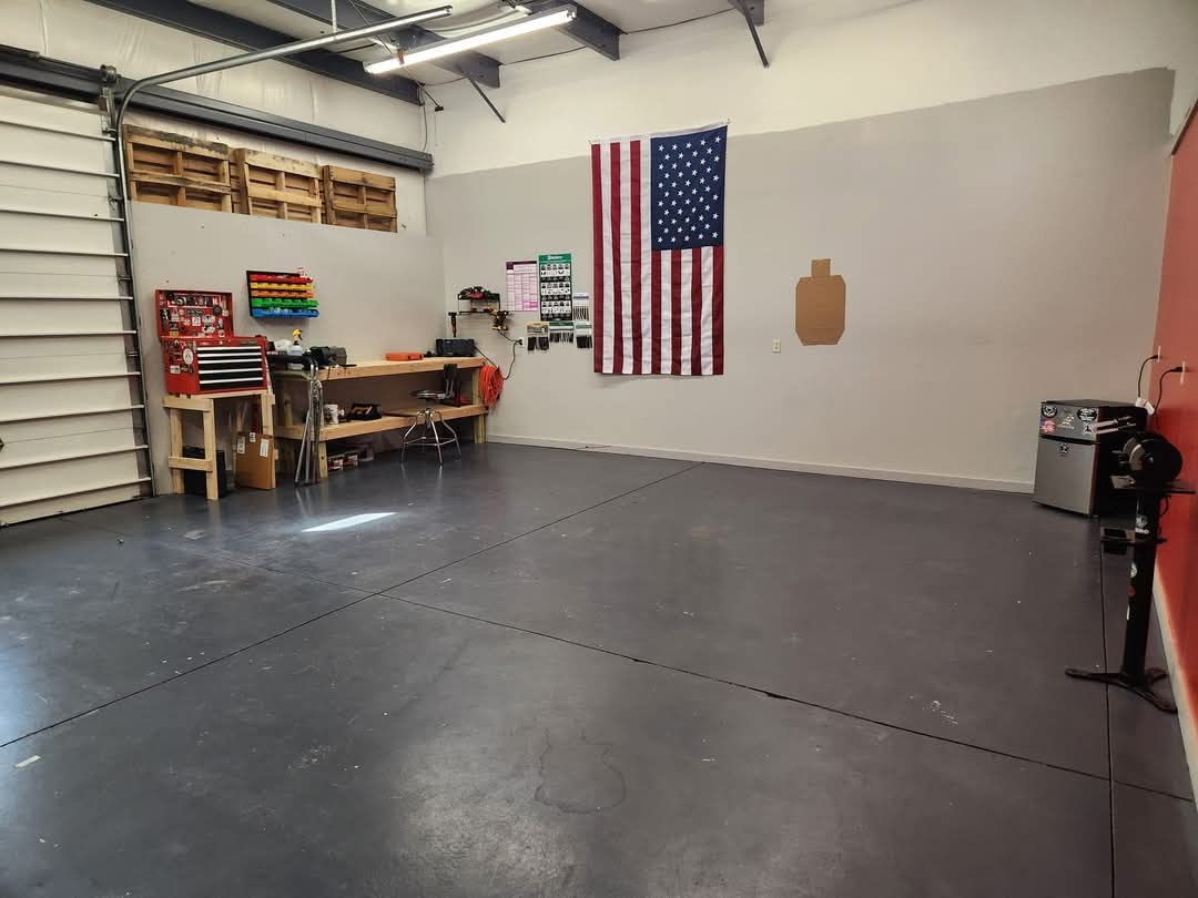 A garage with a large American flag on the wall.