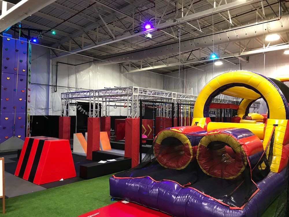There is a large inflatable obstacle course in the middle of the room.