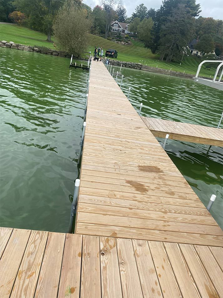A wooden dock leading into a body of water.