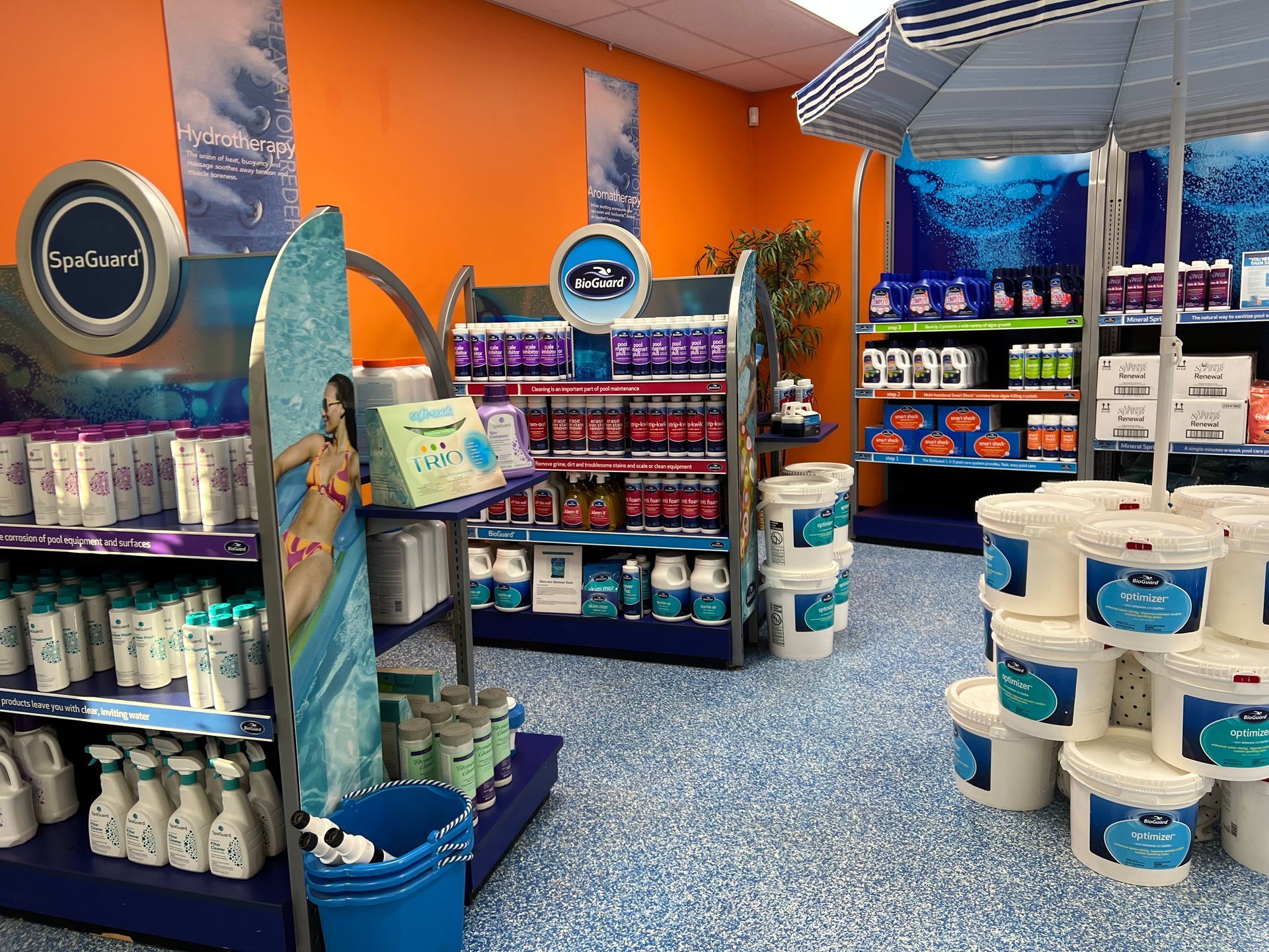 a store filled with lots of buckets of pool supplies .