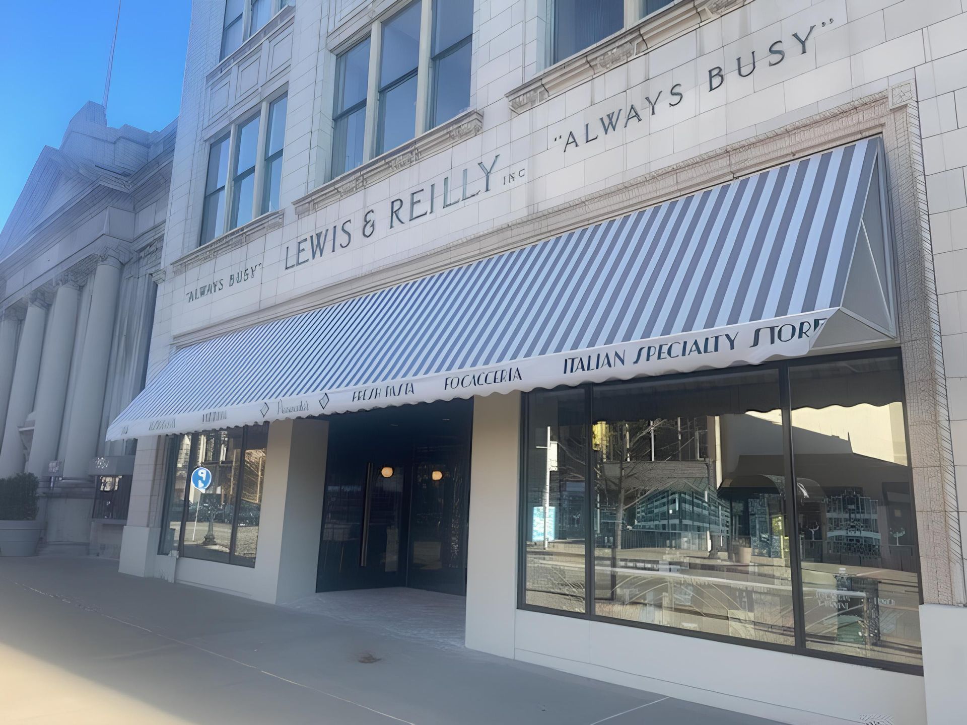 Man in blue shirt installing a white awning above a window.