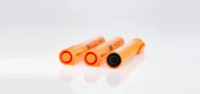 Three orange pen on a white background, one showing a black top.