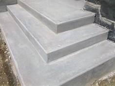 Concrete steps leading up, gray and smooth, outdoors.