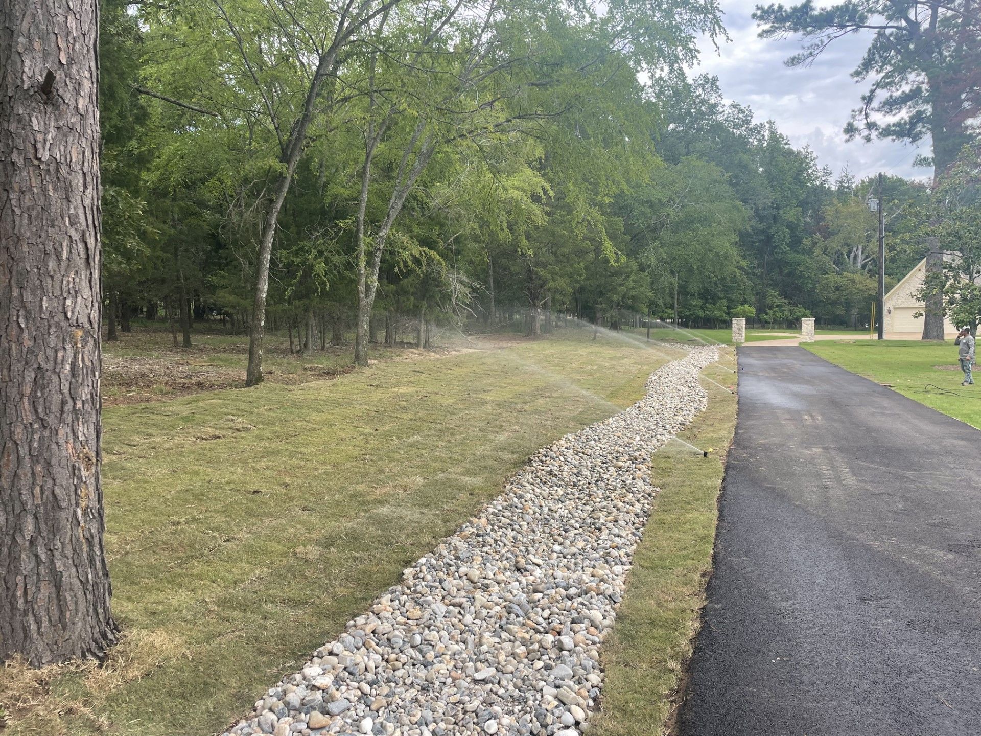 A gravel path runs along the side of a road.