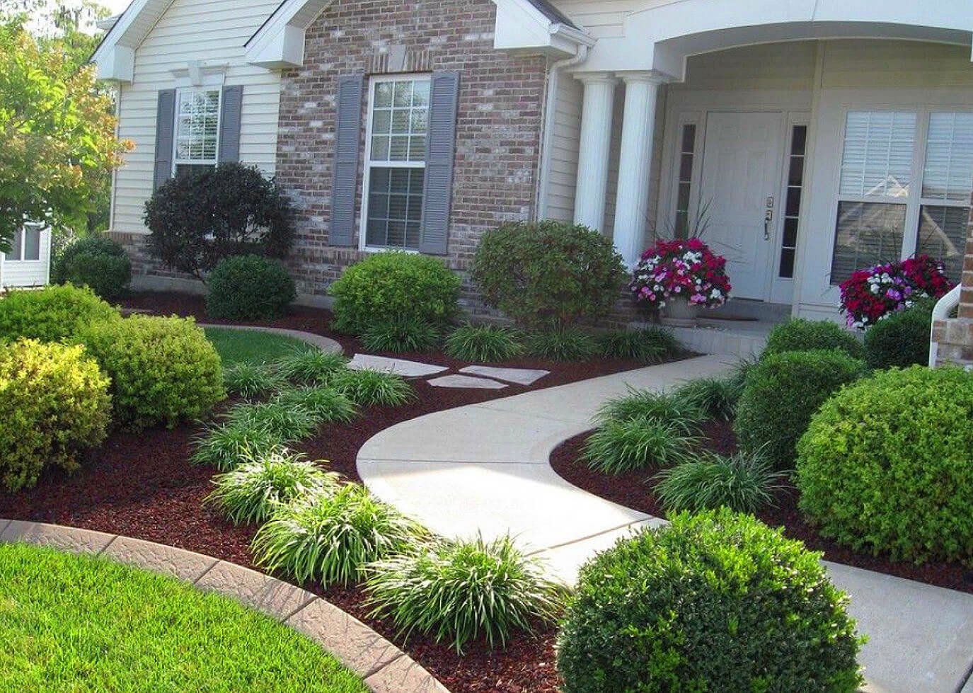 A house with a walkway leading to the front door