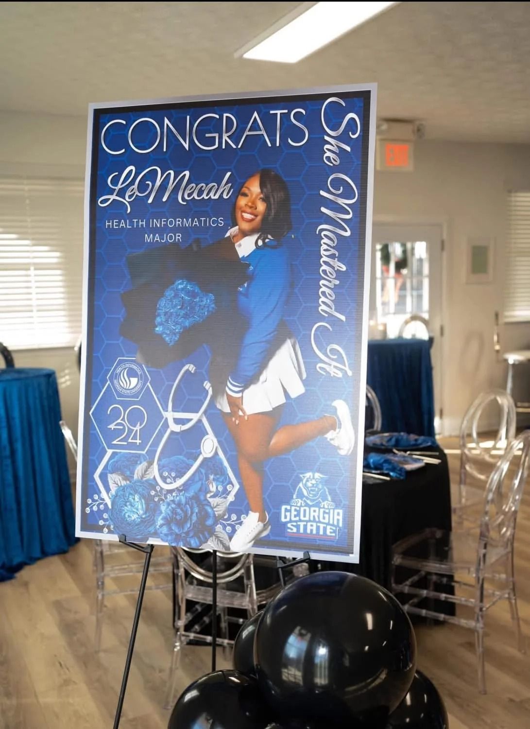 Graduation sign for LeMicah at Georgia State, blue and white theme. Celebratory.
