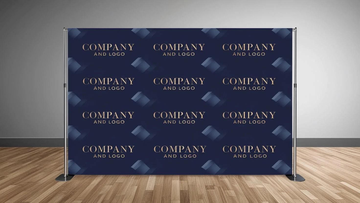 A navy backdrop with repeating logos and brushstroke pattern, displayed on a metal stand, set on a wooden floor.