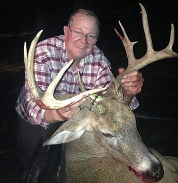Man holding deer antlers