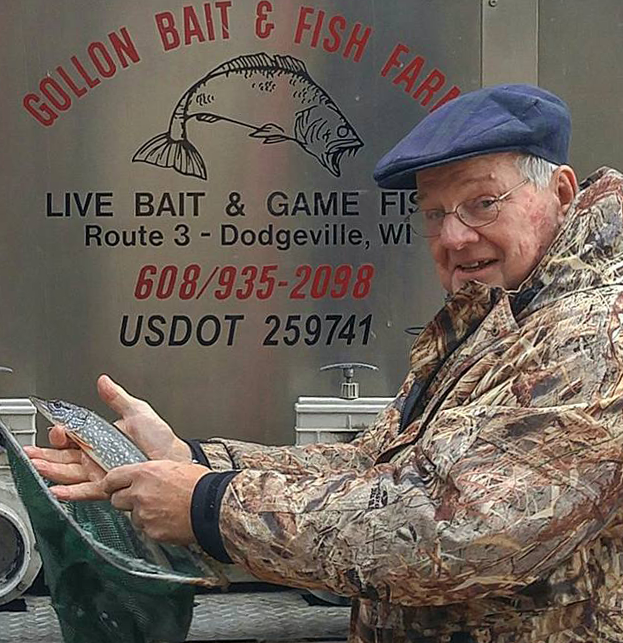 Smiling man holding a fish