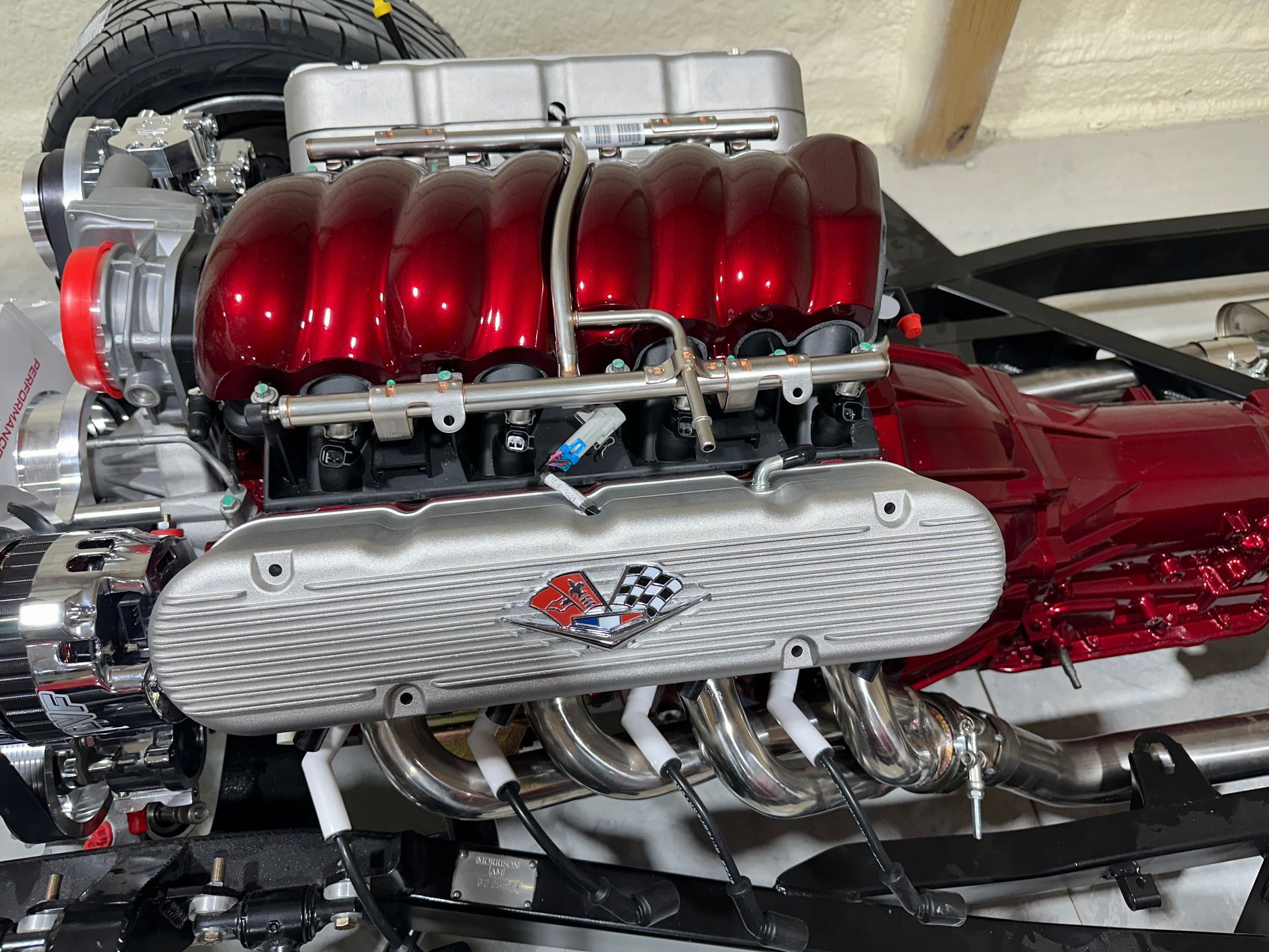 A red and silver engine with a checkered flag on the cover