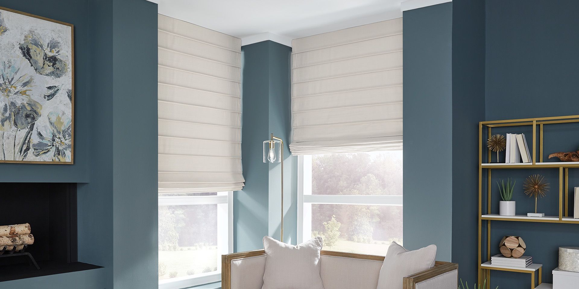 Blue and white corner room with large windows, beige blinds, shelving, and a fireplace