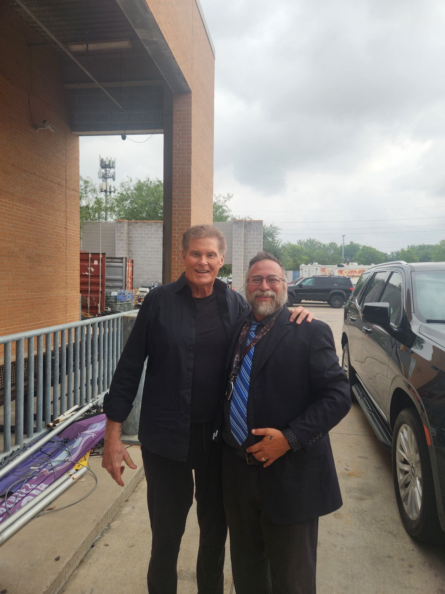 David Hasselhoff posing with another person.