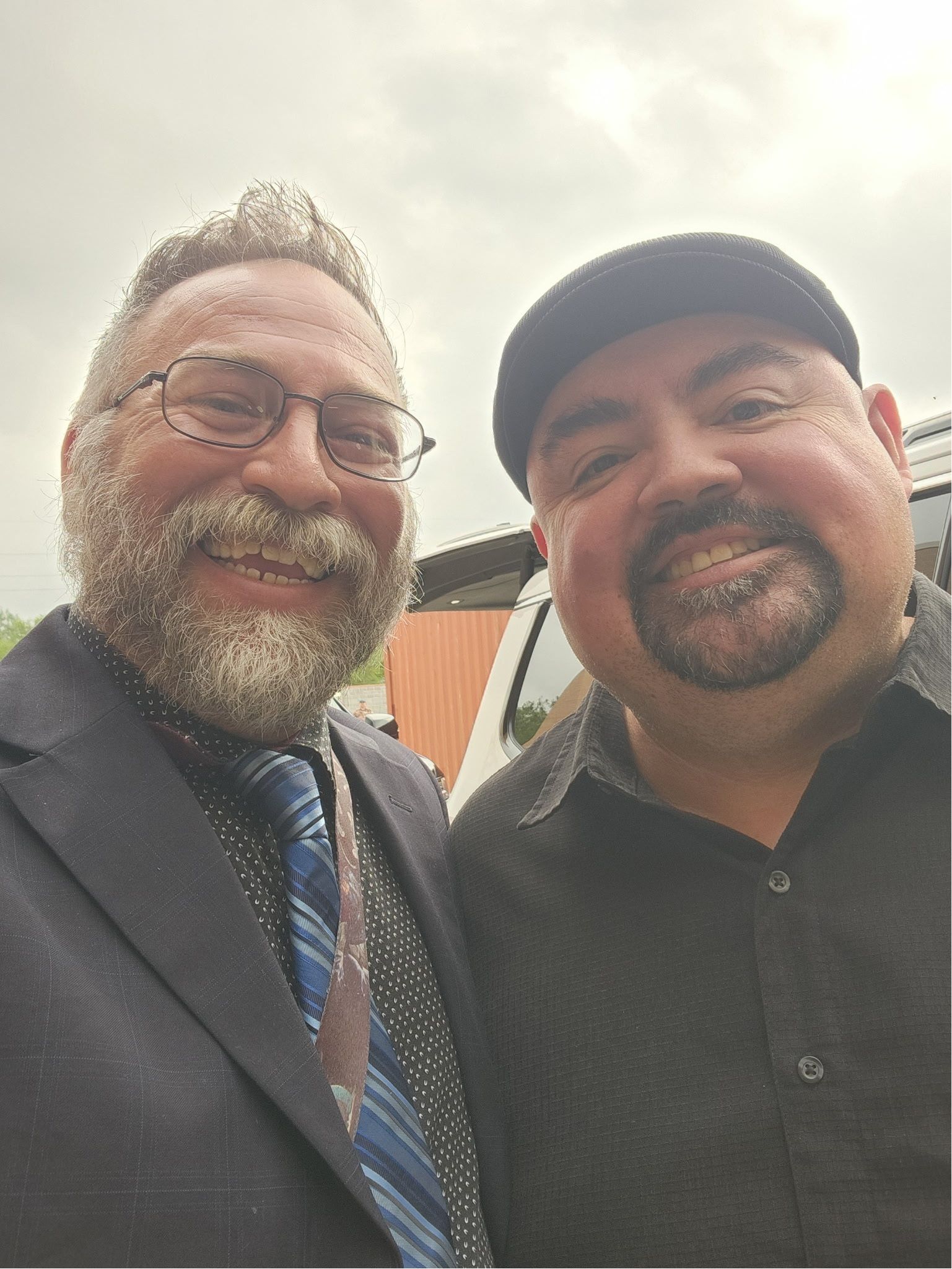 Gabriel Iglesias (Fluffy) smiling with another person.