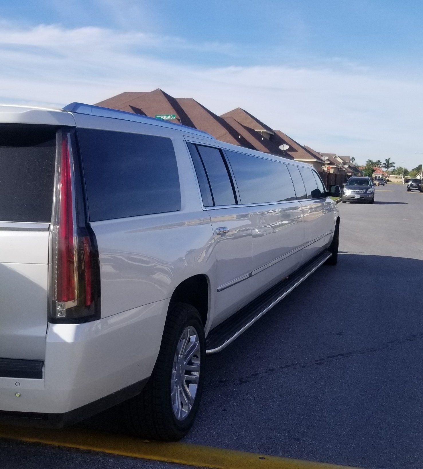 Back of a white Escalade limo