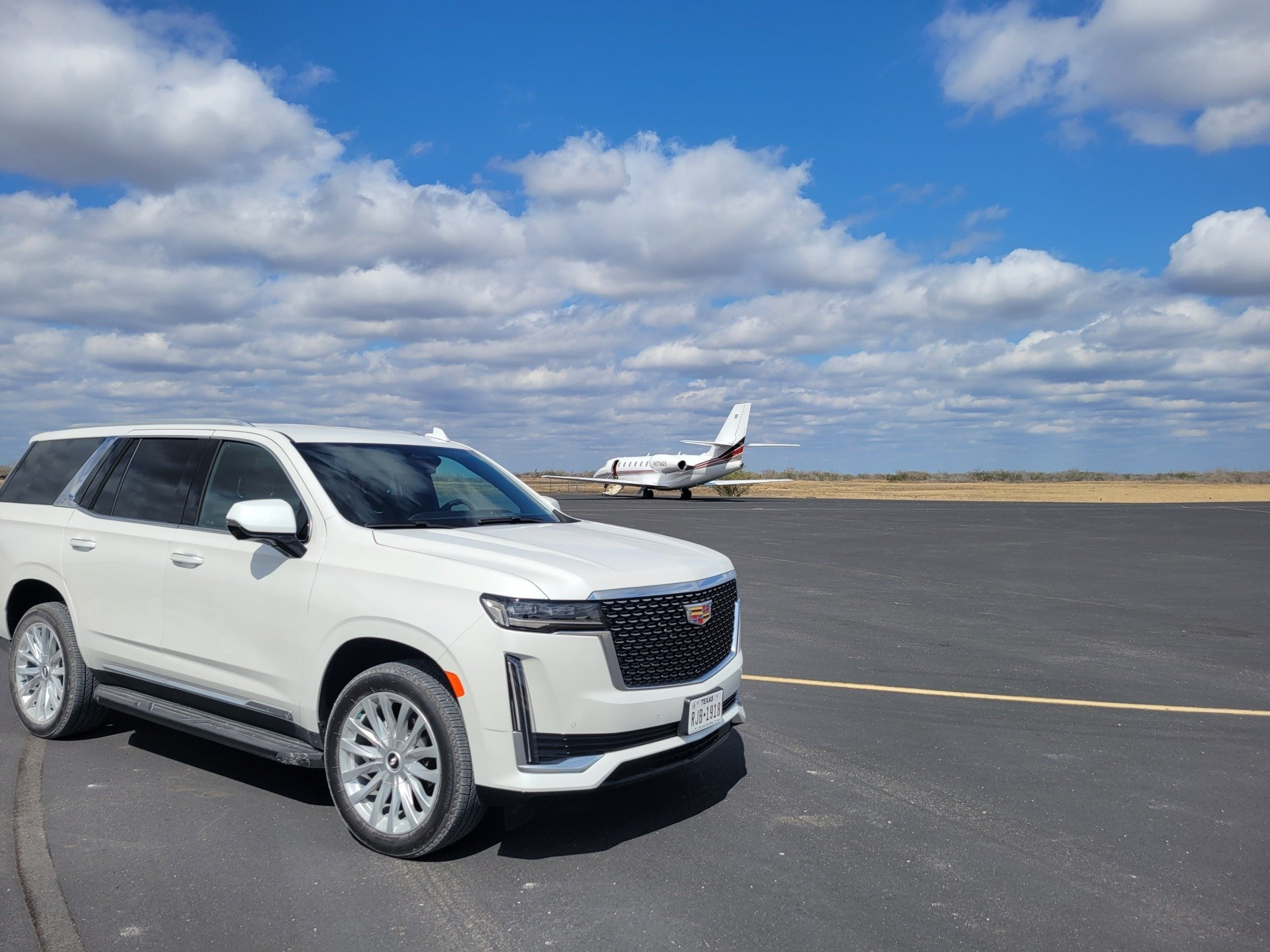 White Escalade on an airport