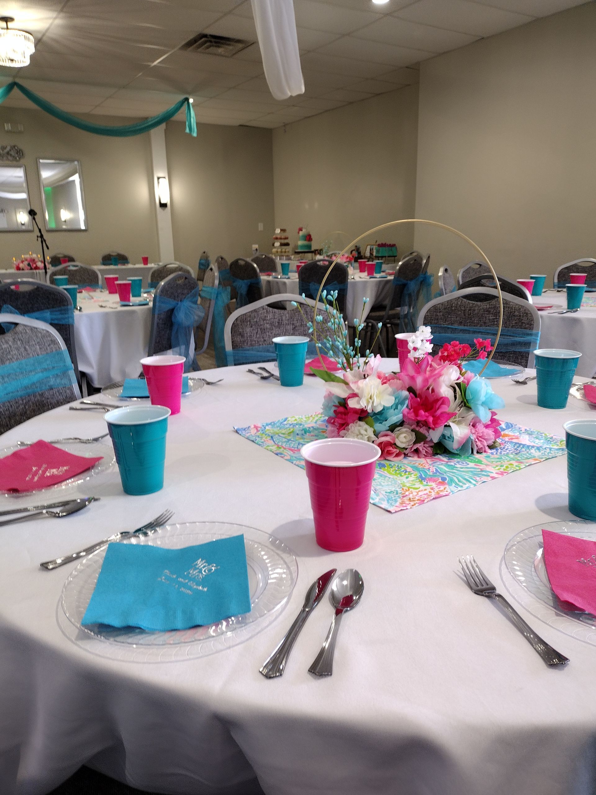 A room with tables and chairs set up for a party
