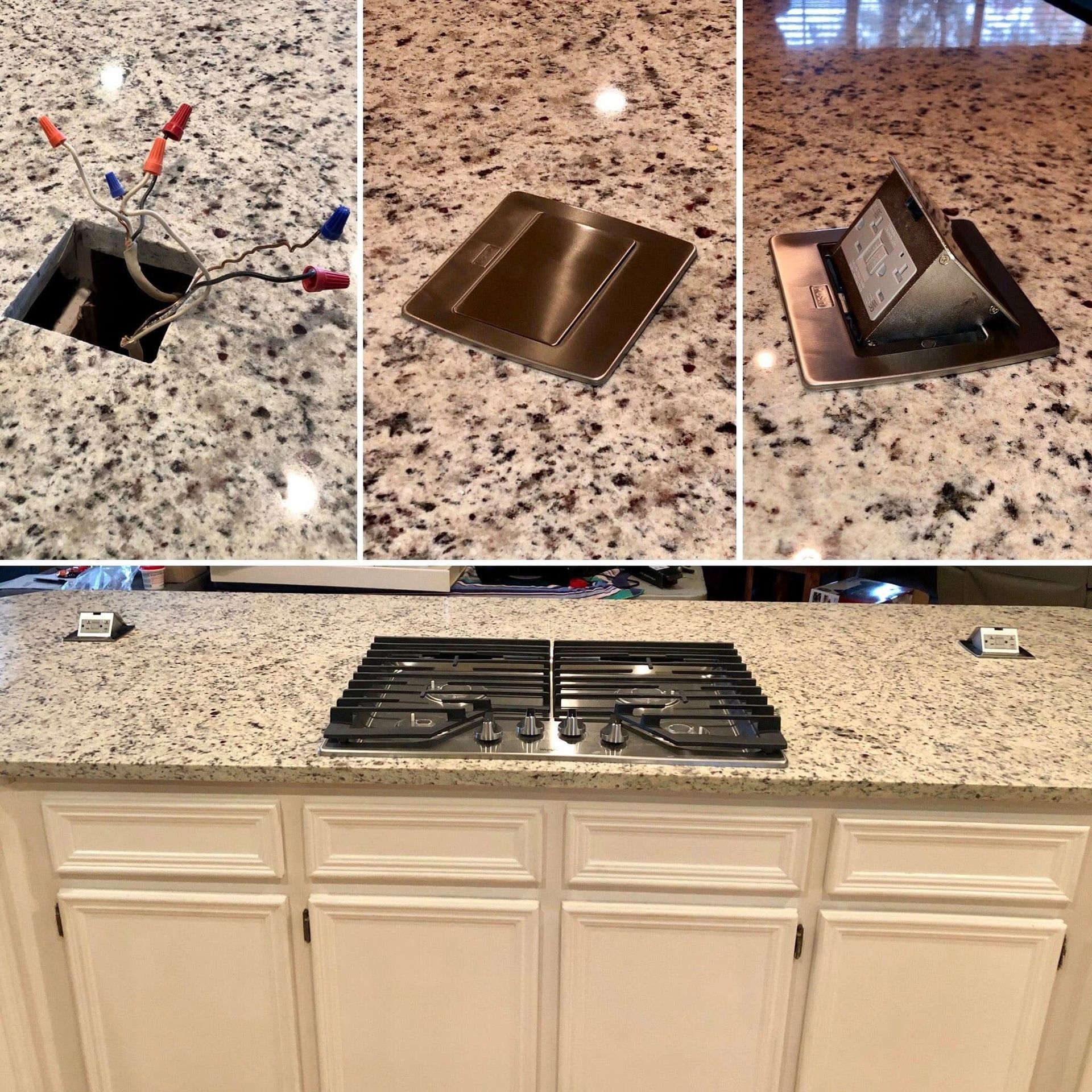 Granite countertop with built-in pop-up outlets and stovetop, white cabinets below.