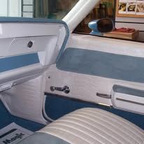 A close up of the interior of a car with blue and white trim.