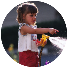 Child with water hose
