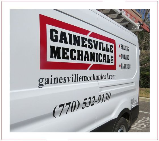White service van with Gainesville Mechanical logo, website, and phone number on the side