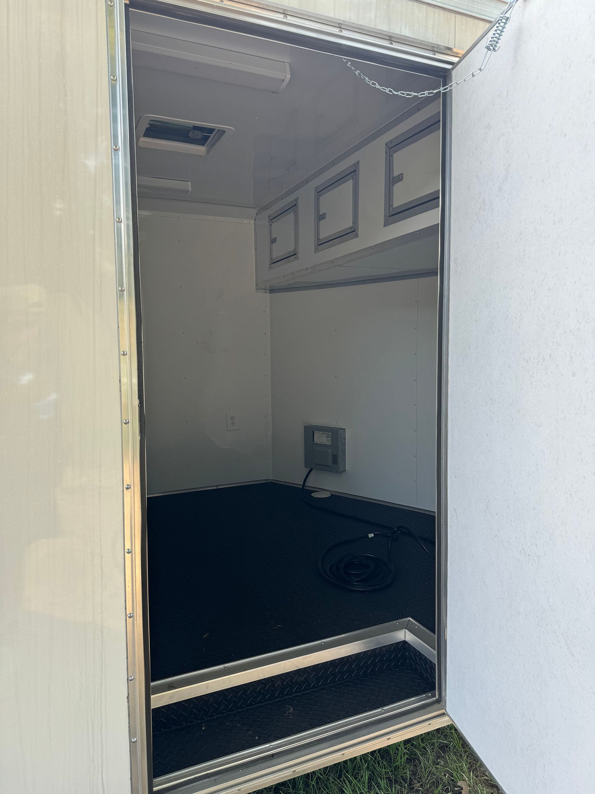 The inside of a trailer with the door open