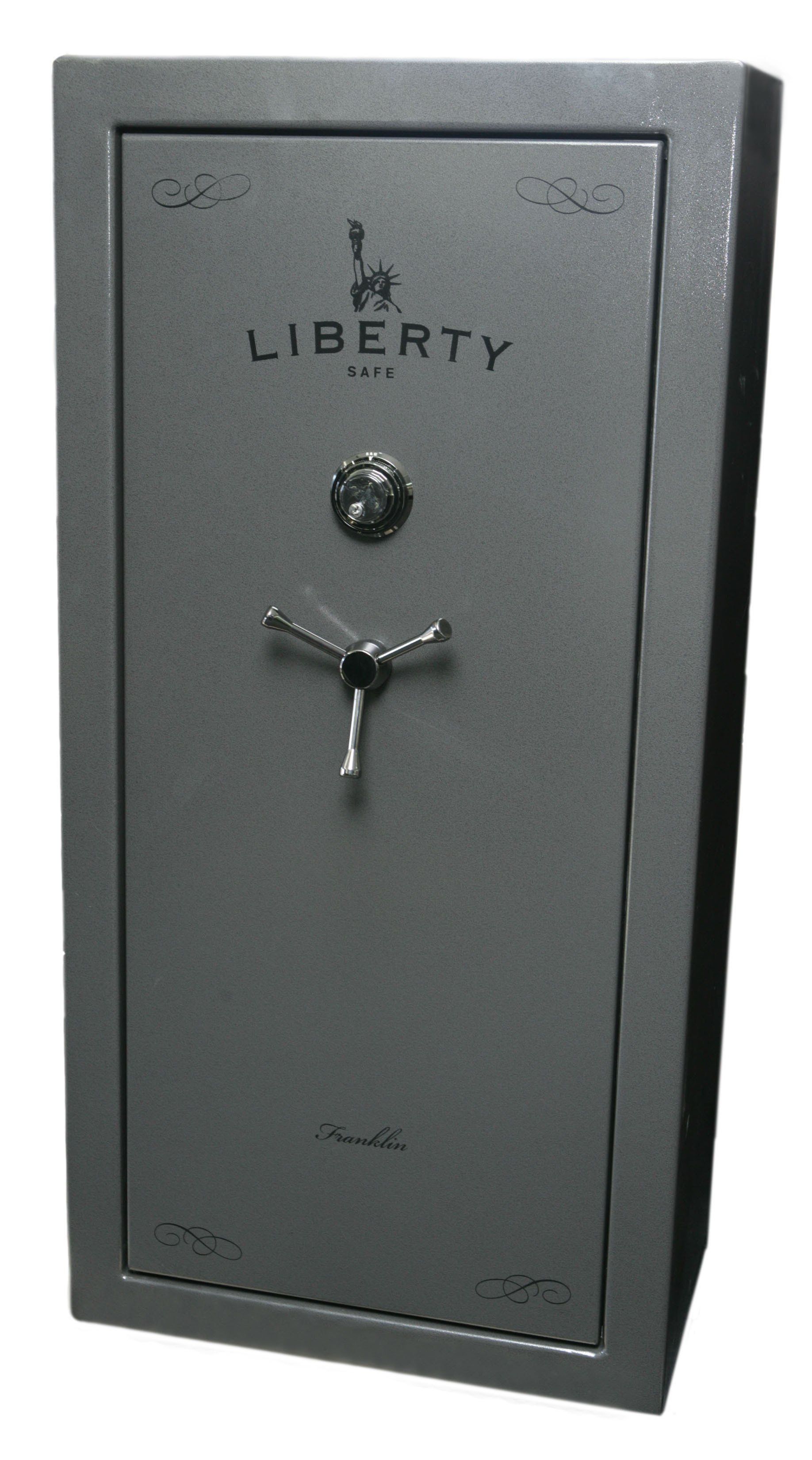 A gray Liberty gun safe with a combination lock and handle, against a white background.