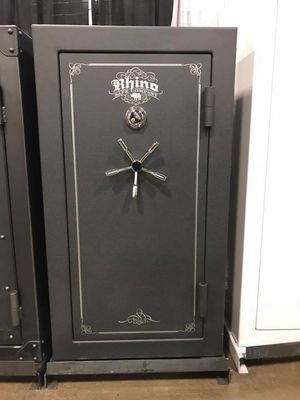Gray Rhino gun safe with a silver combination lock and handle.