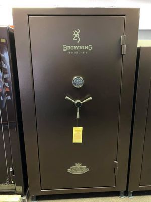 Brown gun safe with a Browning logo, brown color, and a dial lock.