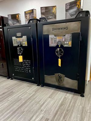 Two black Browning gun safes displayed in a store, with security features visible.