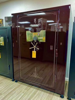 Brown Browning gun safe with a combination lock, in a retail setting.