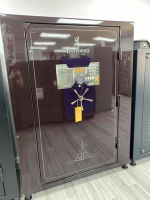 Brown Browning safe with a digital keypad and a combination dial.
